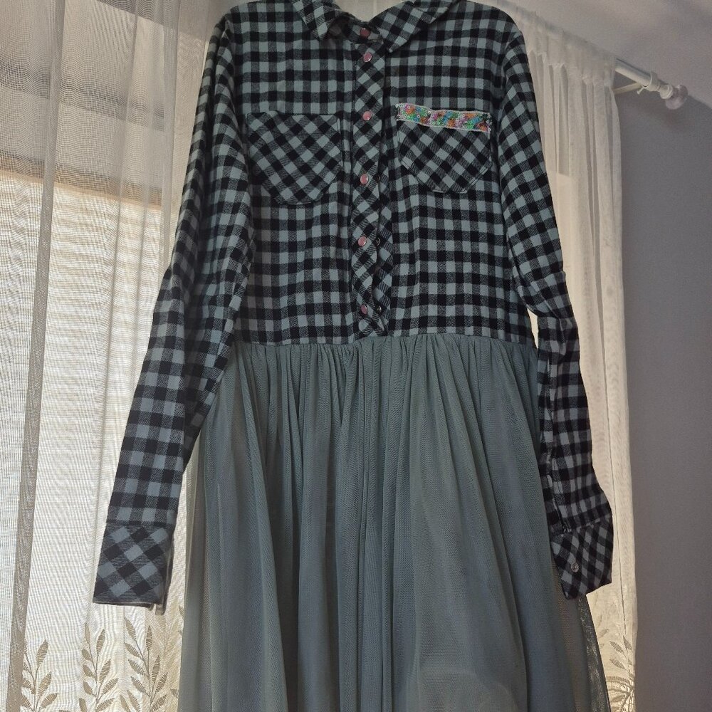 Beautiful girl's mint gingham dress with sequin lined pockets and pink buttons!